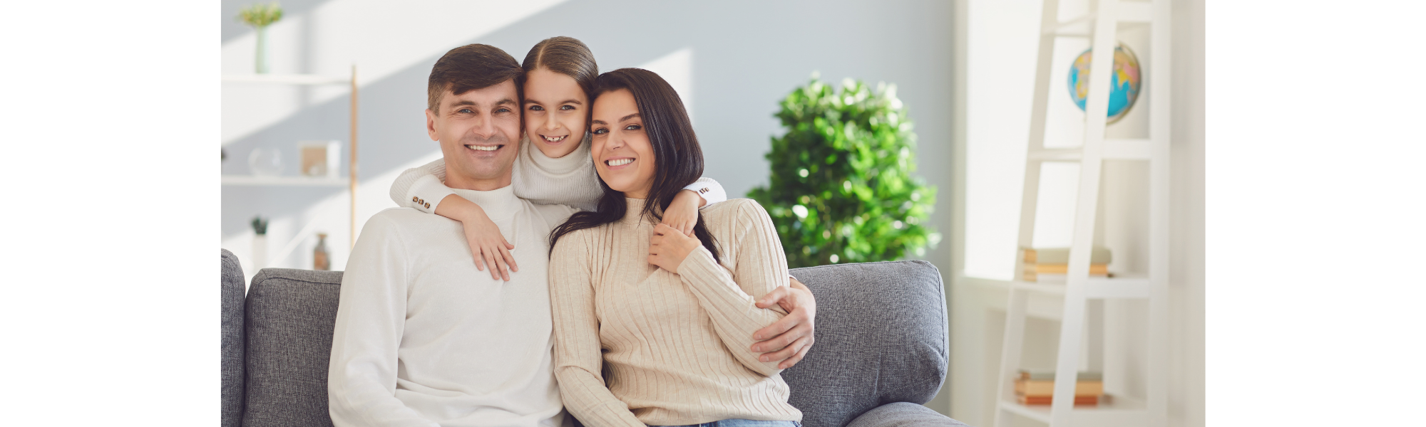 happy family sitting on a couch 